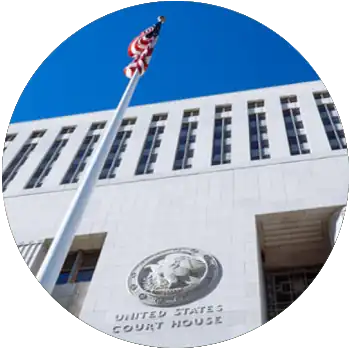 The American flag waves in front of the United States Court House.