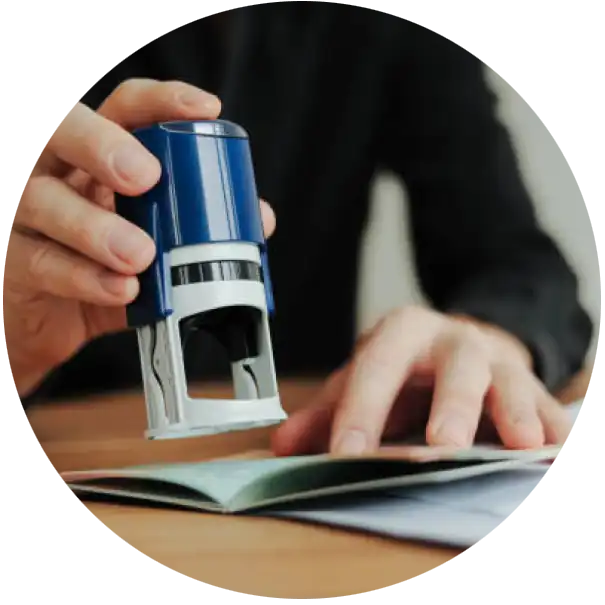 Image of a person making stamp on a document.